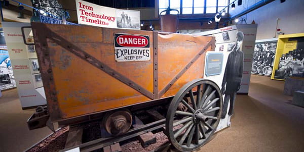 A large mining rail car in a museum exhibit