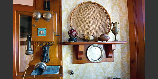 Antique telephone on the wall in the Mann House.