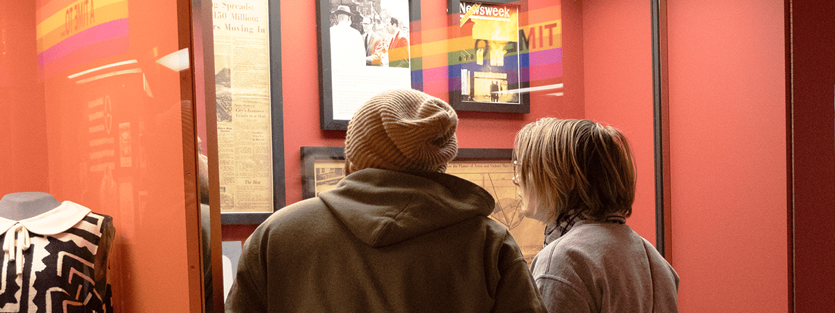 Two visitors looking at an exhibit.