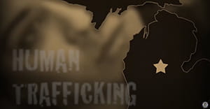 Map of Michigan with the words human trafficking superimposed