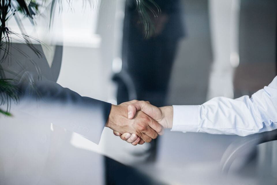 Two people shaking hands
