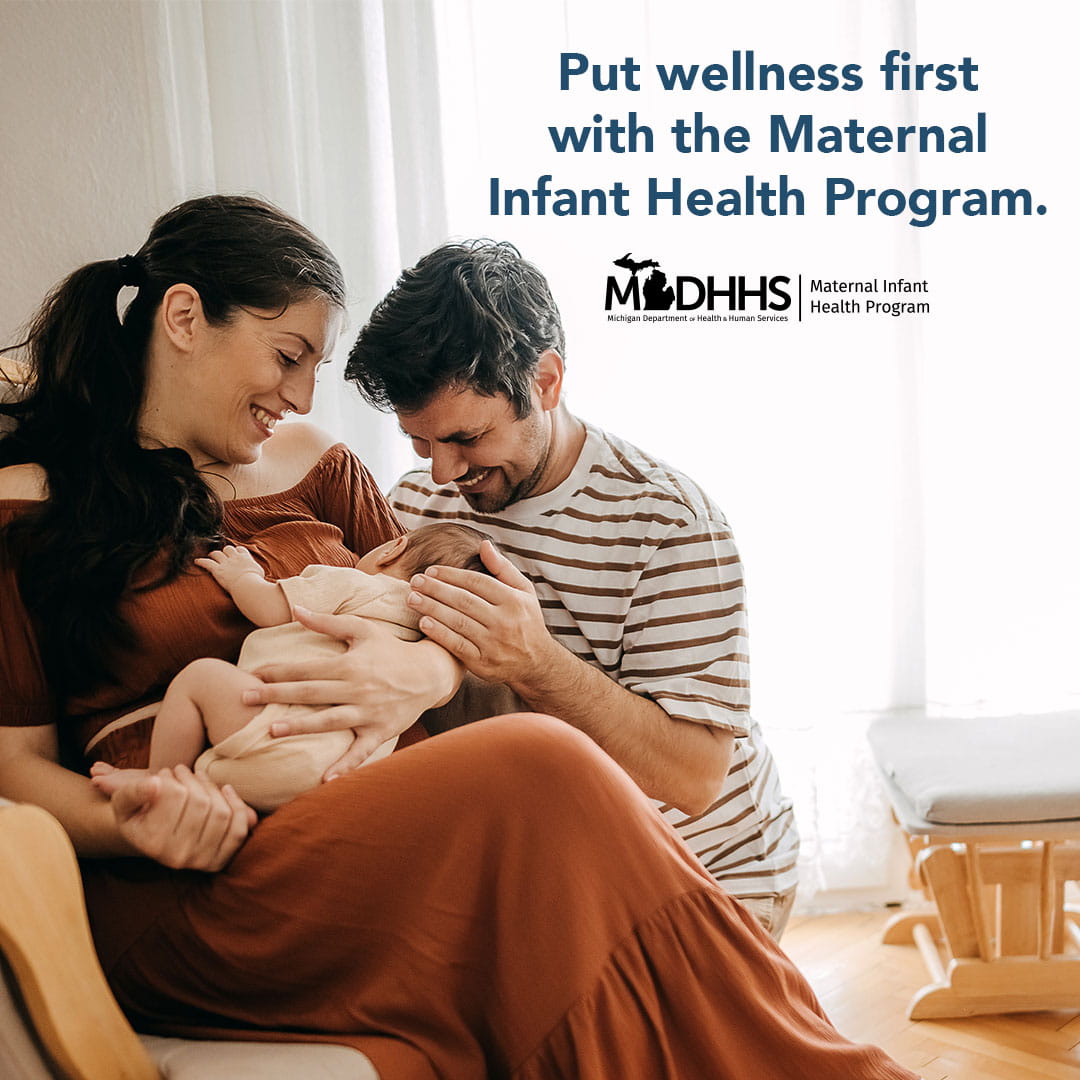 Image of family holding baby