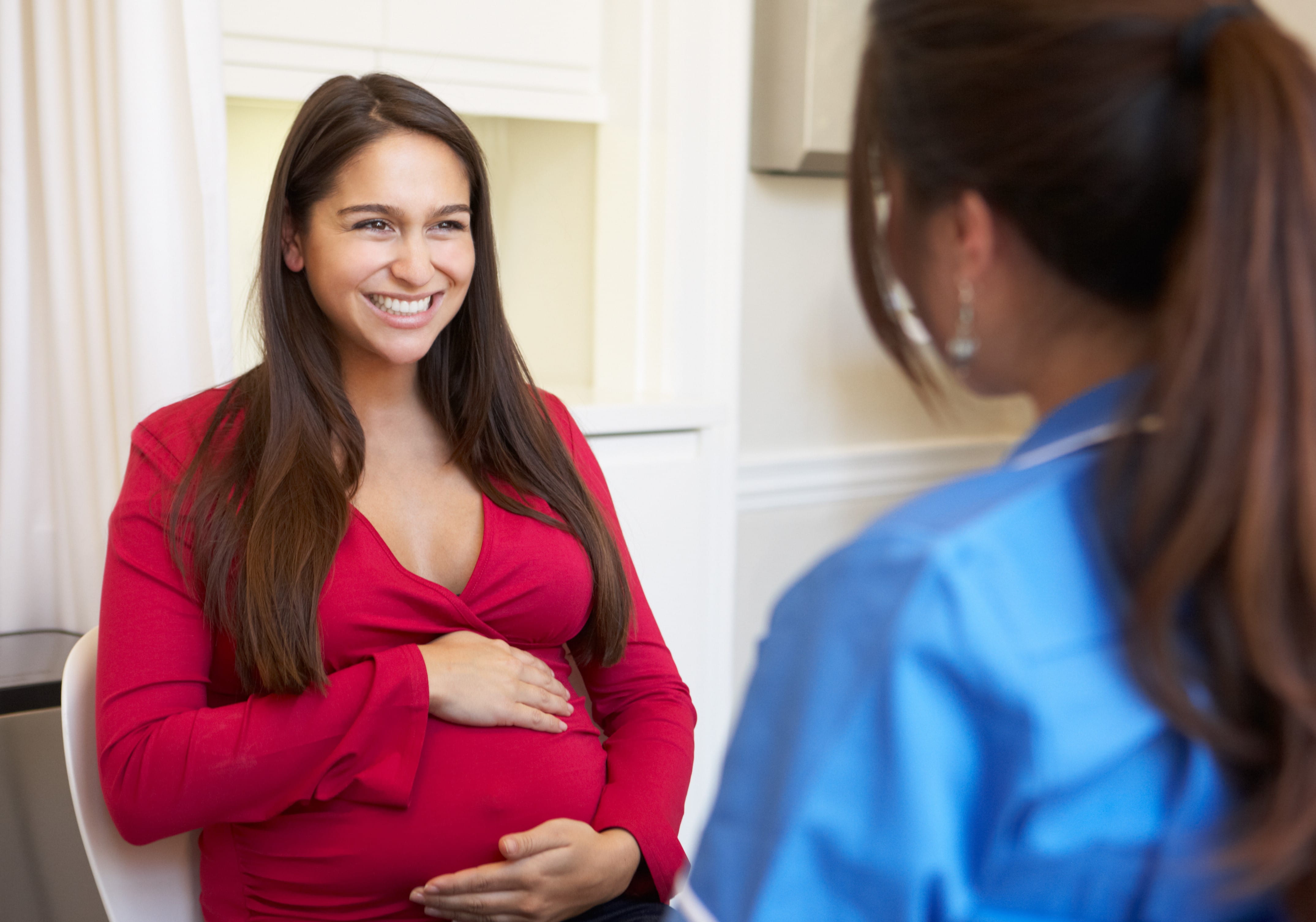 pregnant person speaking with professional