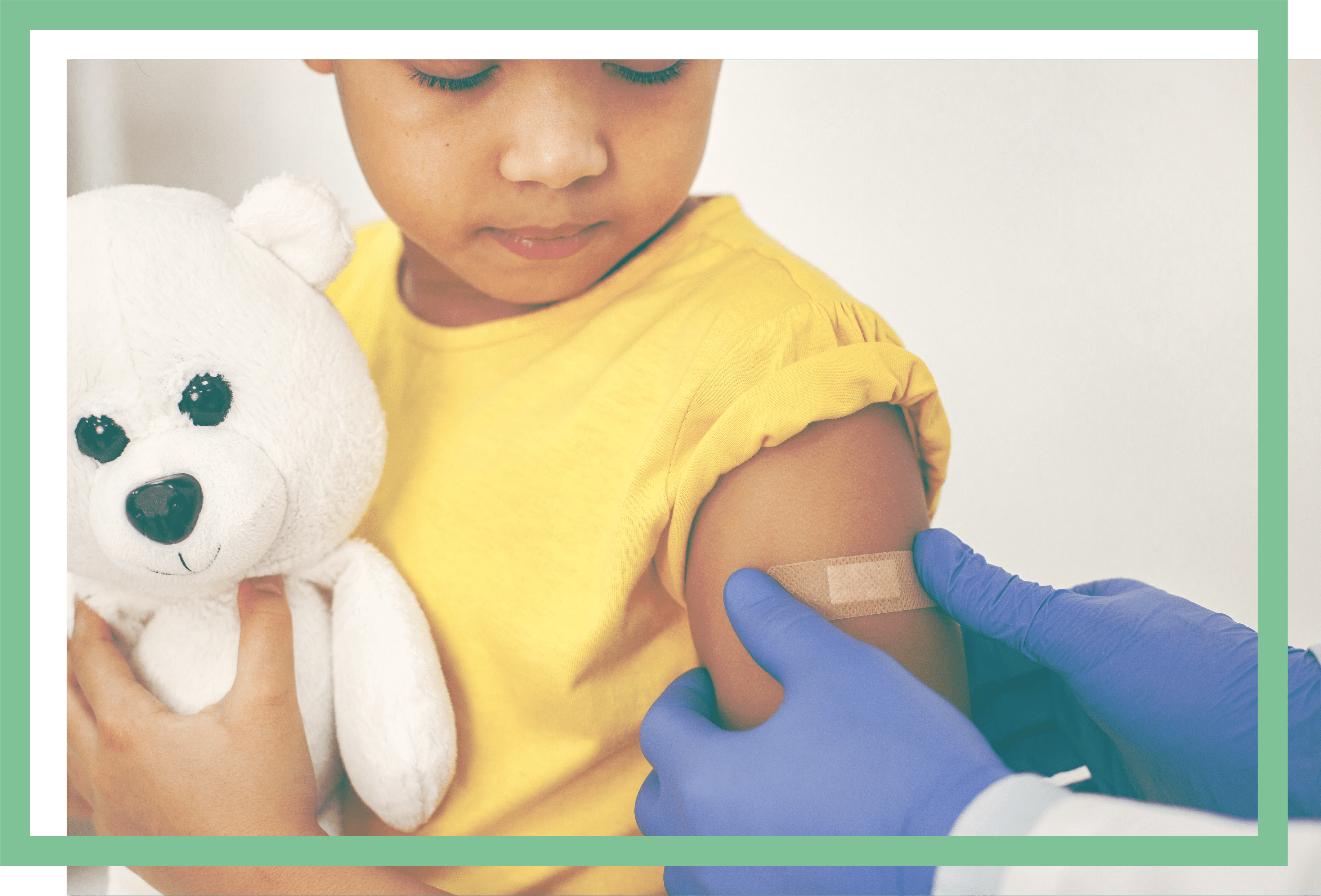 Little boy getting bandage after vaccine
