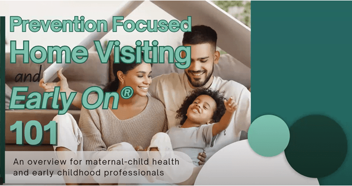 two caregivers smiling with a child