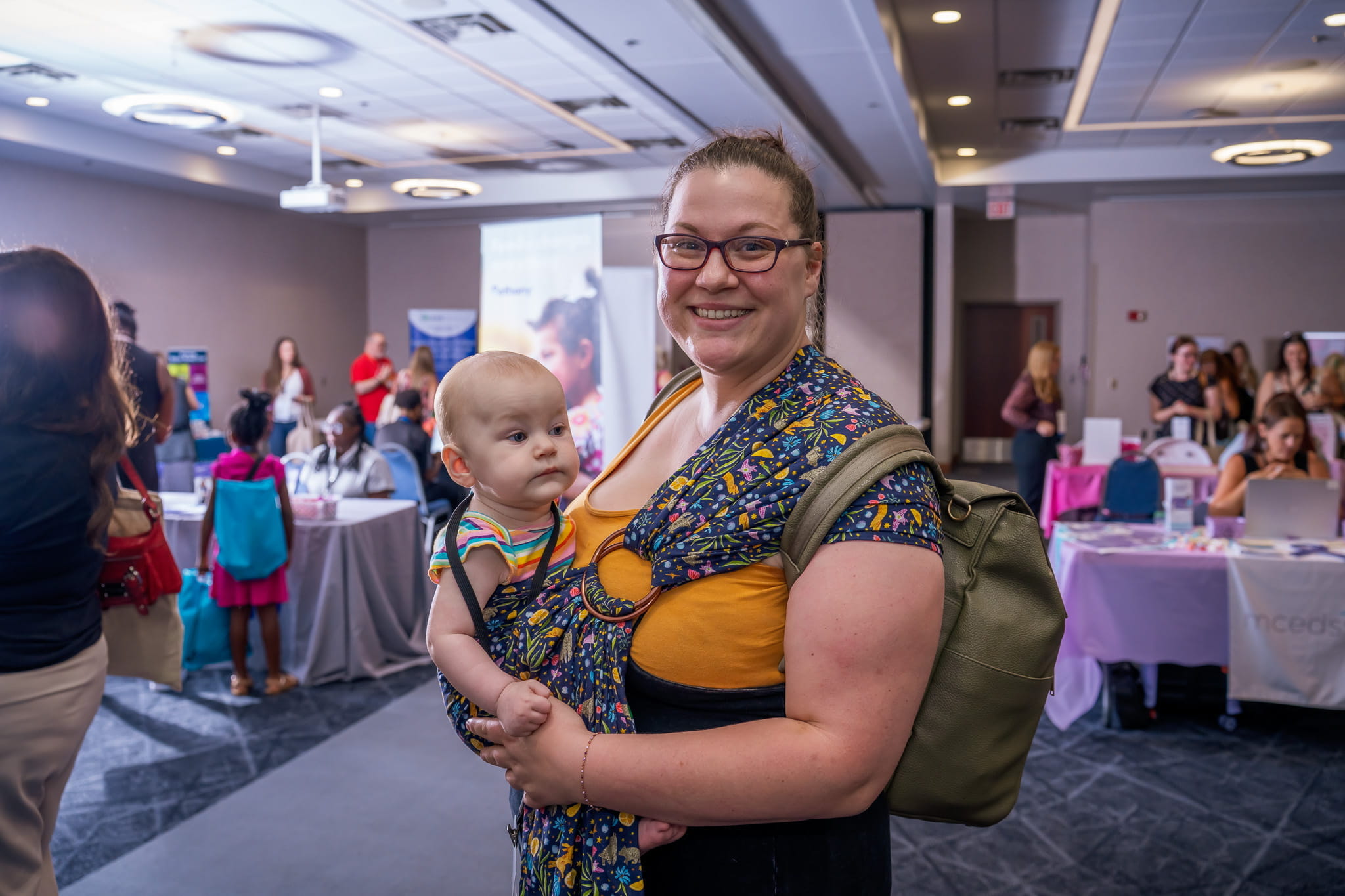 Woman with baby in front carrier