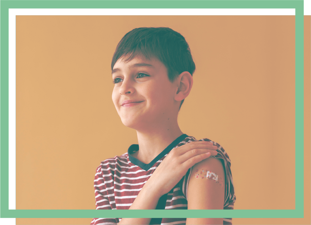 young boy with bandage on shoulder