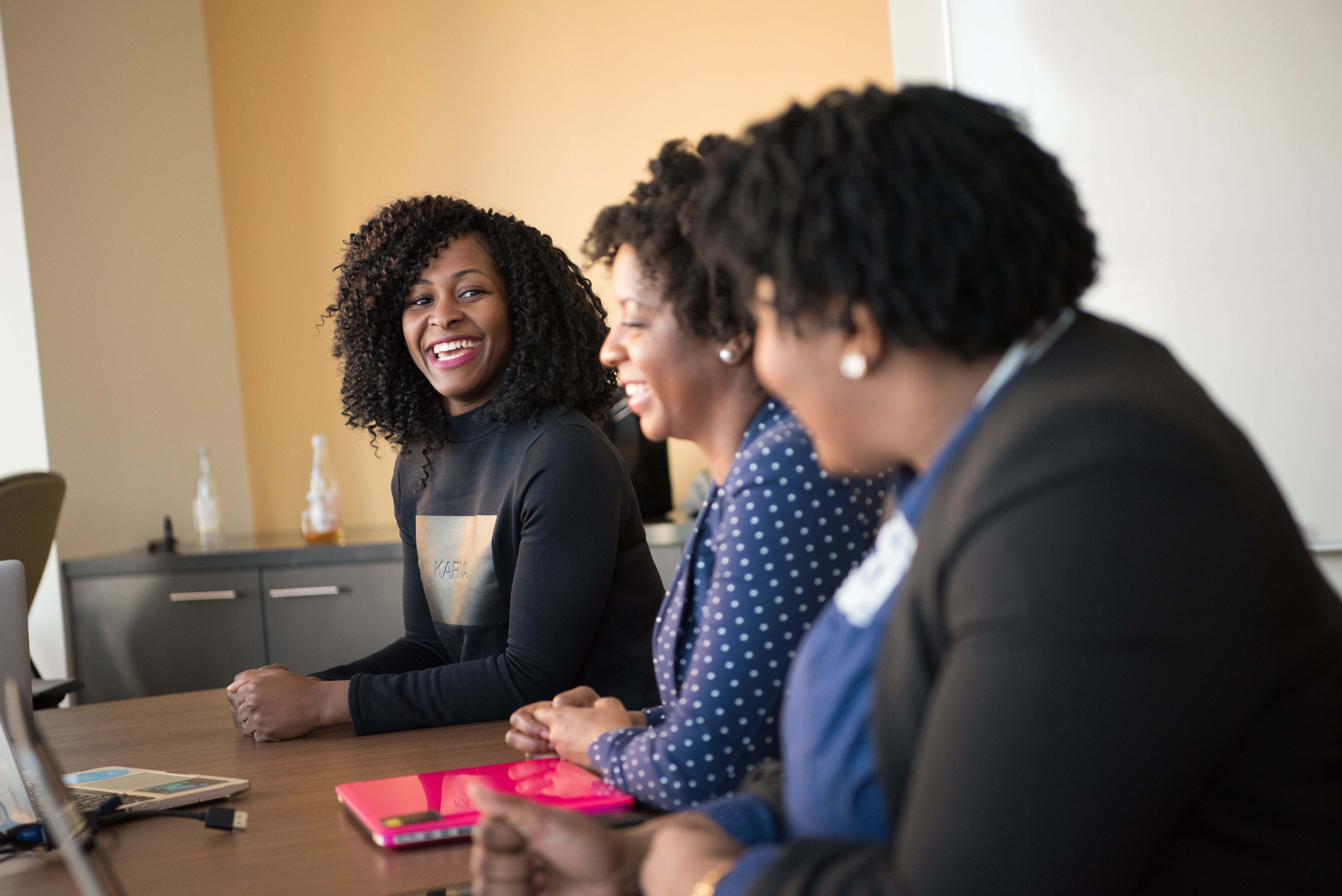 three people working together in an office setting