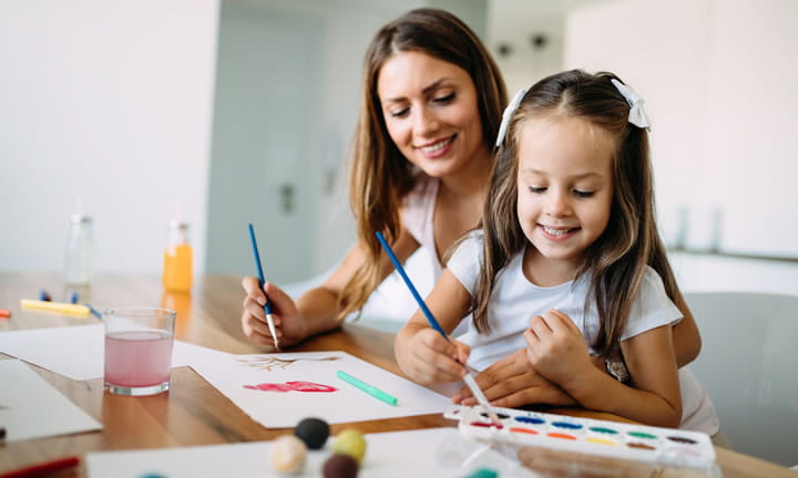 mom and preschooler daughter painting