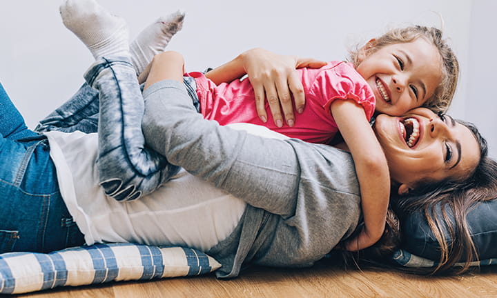 mom hugging daughter