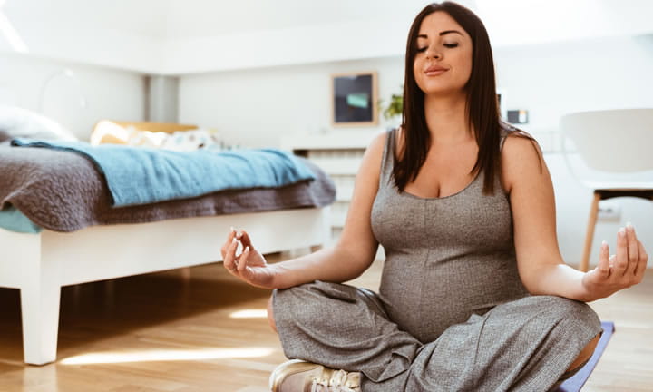 expectant mom meditating