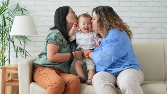 moms kissing baby