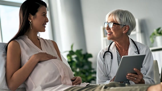 expectant mom  talking with doctor in office