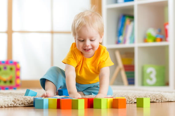 toddler playing with blocks