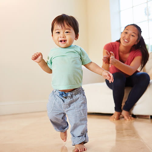 toddler walking away from mom