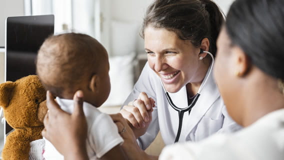 doctor with mother and baby