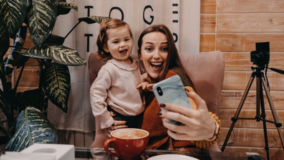 mom and daughter taking a selfie