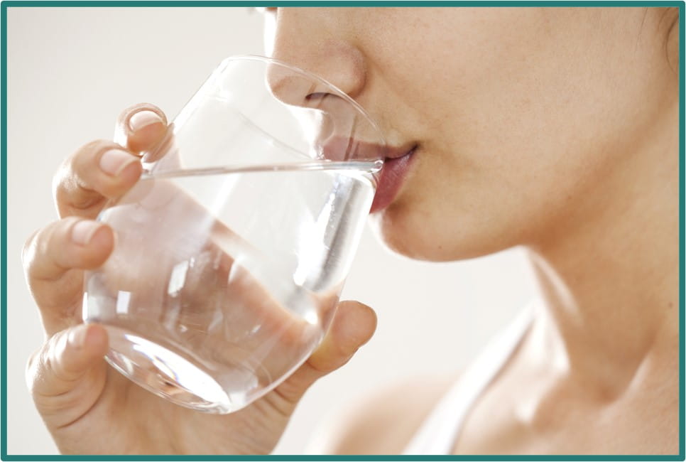 Drinking water - woman drinking glass of water