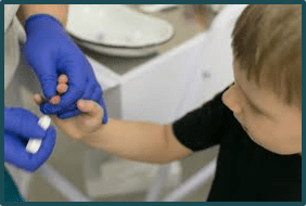 Child getting a blood lead test