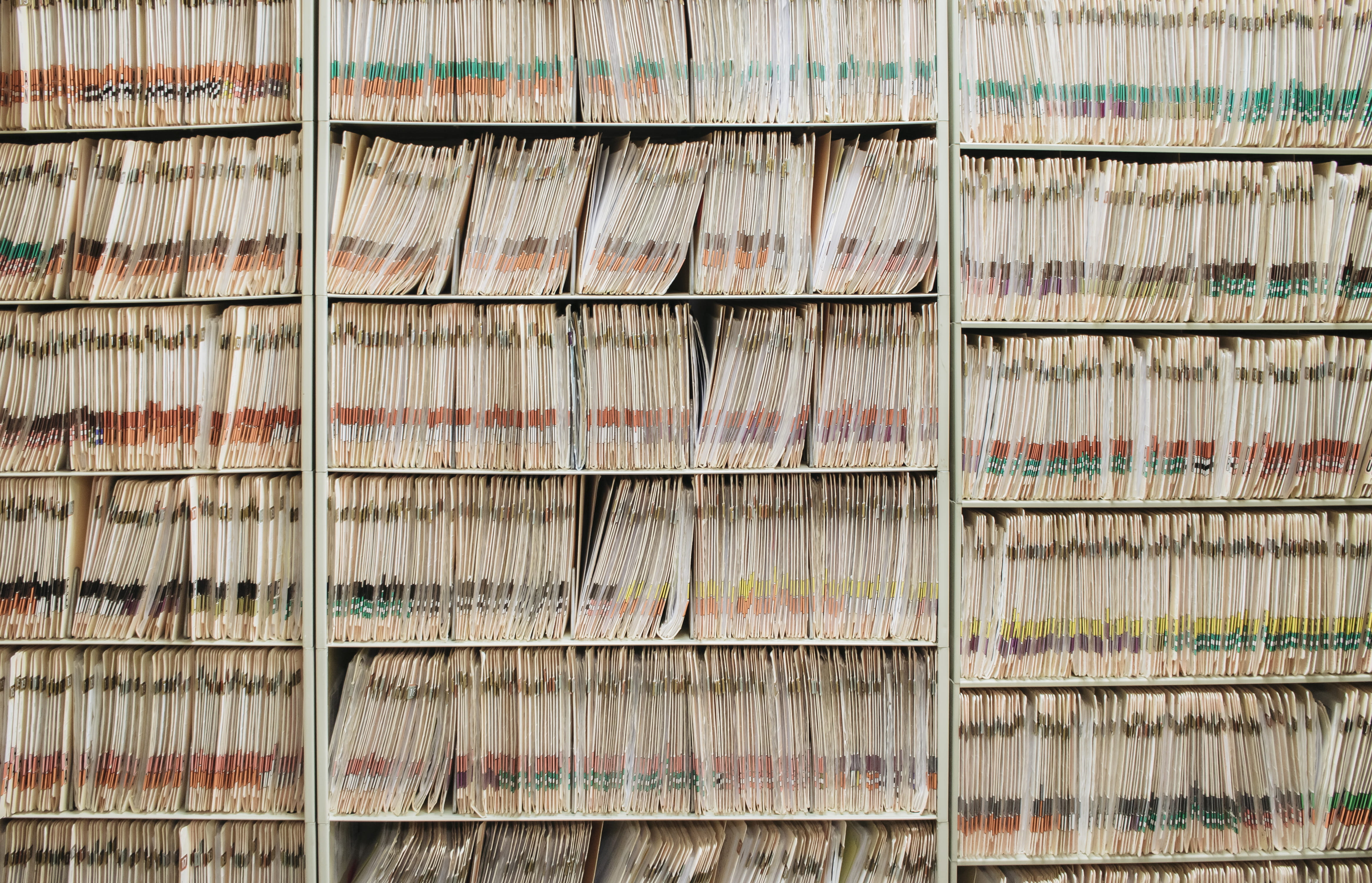 Wall of patient files stacked tightly together