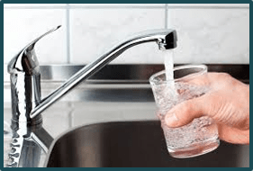 Glass being filled with tap water