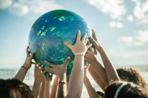 arms holding up a globe