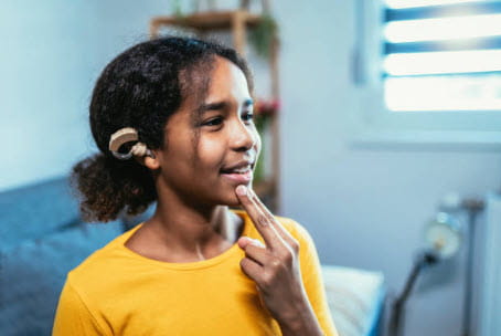 girl with hearing aid