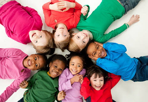 kids in a circle lying down