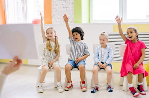 kids raising hands to ask question