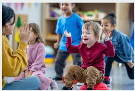 boy in red sweater looking at teacher