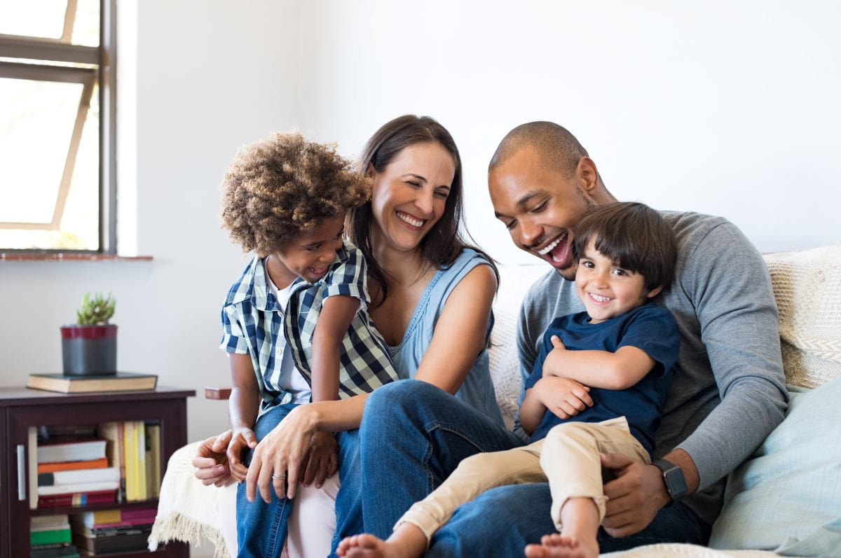 Family sitting together on a couch