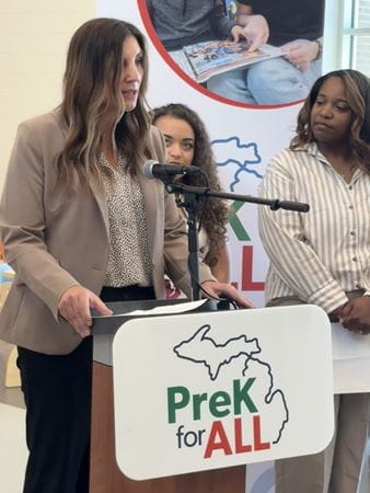 Teressa Gatza standing at podium, speaking at PreK for All press event