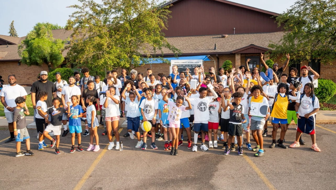 Children pose for group shot at OST event