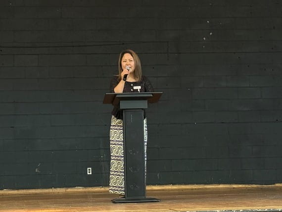 Christina Khim, executive director of The Burma Center, welcomes guests and shares on program impact.