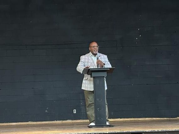 MiLEAP deputy director of Education Partnerships Rawlan Lillard II speaks to the importance of 32n invesments and celebrates The Burma Center staff, children and parents on their success.