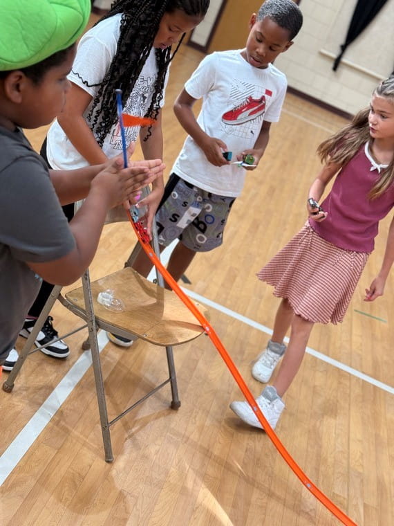 Students watching an activity