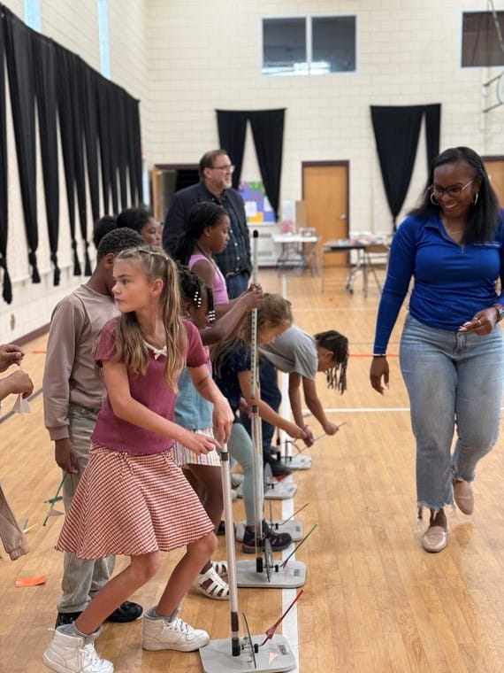 Students working on an activity in a gym