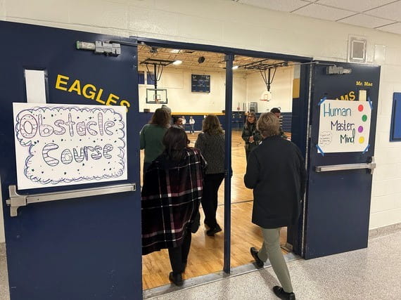 MiLEAP Joins EMU Bright Futures to Celebrate $3.75M Grant Expanding After-School Supports for Wayne-Westland Students  21st CCLC Grant Funds Academic Enrichment and Development Opportunities for More than 900 Students Across 22 Bright Futures Program Sites   Students participate in a two-player buzzer learning challenge led by EMU program leaders during the Fall in Love with Bright Futures event. LANSING, Mich. – The Michigan Department of Lifelong Education, Advancement, and Potential (MiLEAP) recently joined Eastern Michigan University’s (EMU) Bright Futures program to celebrate a $3.75 million, five-year investment through the 21st Century Community Learning Centers (21st CCLC) Grant program. The Fall in Love with Bright Futures celebration showcased how this investment is expanding after-school learning and enrichment opportunities for students across the Wayne-Westland Community School District (WWCSD). “21st Century Community Learning Centers provide essential supports to Michigan students during their most critical years of development,” said Rawlan Lillard II, deputy director of MiLEAP’s Office of Education Partnerships. “When communities, schools, and partners like EMU Bright Futures come together, students get the type of support that changes their confidence and their academic path. This funding is helping more than 900 young people access safe, engaging, and high-quality learning experiences after school while giving families a reliable place where their children can grow and thrive.” Coordinated through EMU’s Institute for the Study of Children, Families, and Communities, Bright Futures operates 22 programs across Wayne-Westland, Ypsilanti, and Romulus, serving more than 920 students throughout the school year and summer. The programs provide academic enrichment, mentoring and social-emotional learning supports to help students succeed in and beyond the classroom. “We are thrilled to celebrate our students and families and to highlight the incredible work happening across all of our Bright Futures sites,” said Dr. Suzie Staley, project director for 21st CCLC Bright Futures at Engage@EMU. “This investment allows us to expand innovative, hands-on learning experiences, strengthen mentoring relationships, and build environments where young people feel supported, inspired and excited to learn.” During the event, families had an opportunity to explore a range of hands-on learning stations hosted by EMU Bright Futures program leaders from all 12 WWCSD sites. Activities included STEM challenges, sensory activities, creative arts projects, and themed engagement tables designed to showcase what students experience daily in their after-school programs. Investments in programs like EMU Bright Futures reflect Michigan’s broader commitment to expanding access to high-quality programs that support working families and help equip more Michiganders with the academic, social, emotional and real-world skills they need to thrive. For more information about the Michigan 21st CCLC Program and other Out-of-School Time resources, visit MiLEAP’s Education Partnerships webpage.   Families enter the gynmasium at Adams Middle School to observe obstable course activities during the Fall in Love with Bright Futures event.