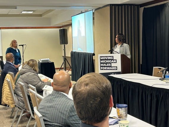 Attendee asks questions to the panel.