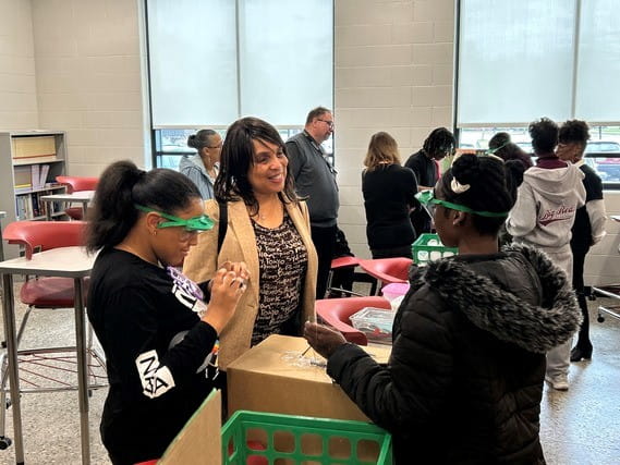 MiLEAP Director, Dr. Beverly Walker-Griffea, observes students participating in the NASA STEM challenge.