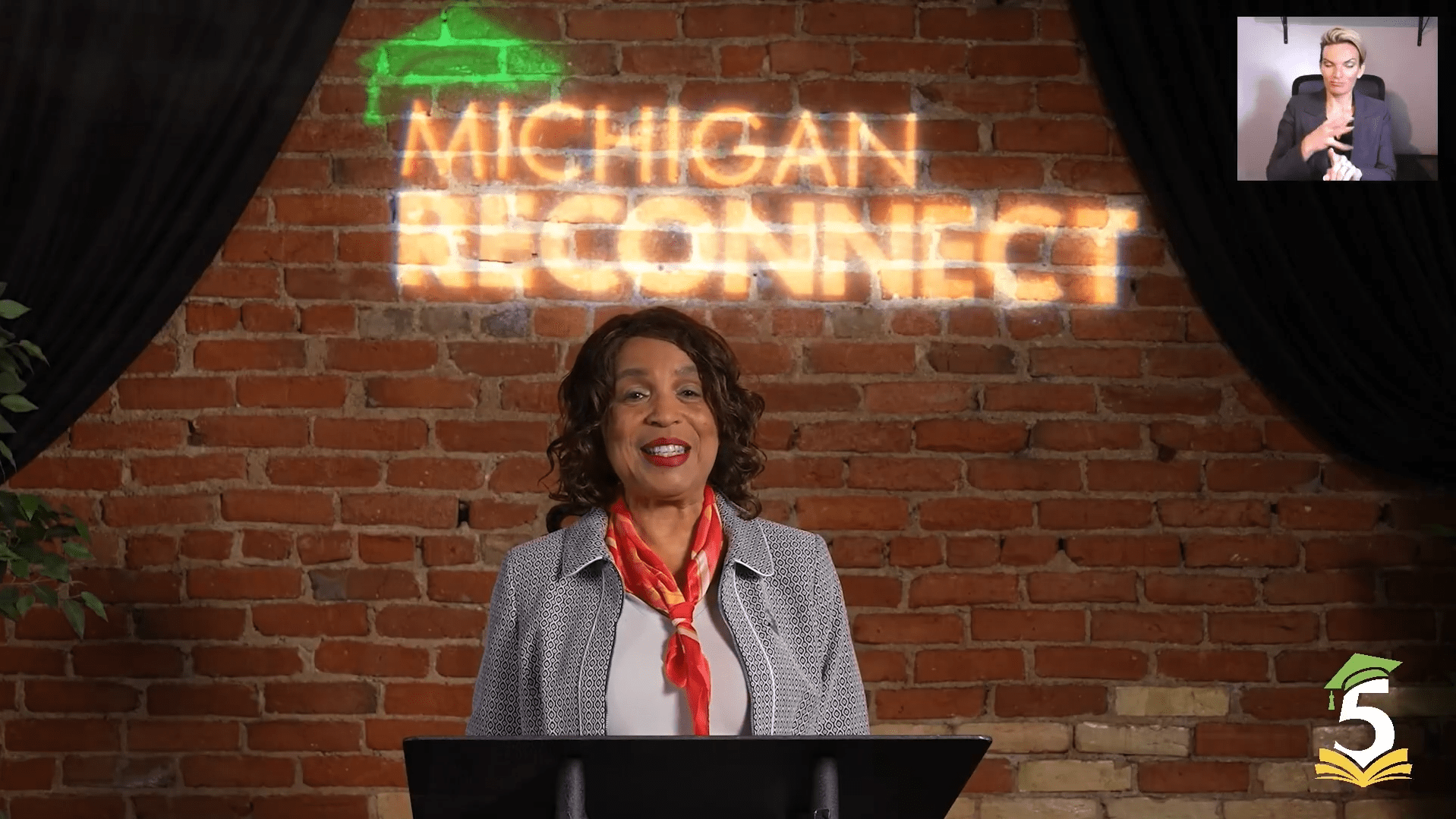 Dr. Beverly speaking at the Michigan Reconnect 2026 Graduation Ceremony