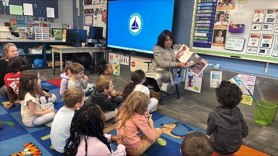 Dr. Beverly Walker-Griffea reads to students in Mrs. Furney's kindergarten class during a visit celebrating literacy