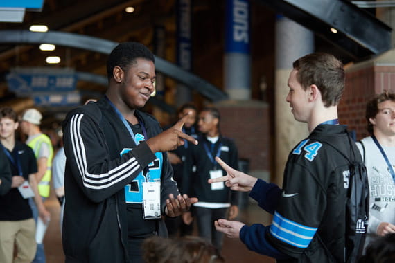 Students break the ice with a game of rock, paper, scissors.