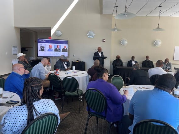 Panelists participate in a discussion during the Men in Motion Summit at Eastern Michigan University on May 29, 2026.