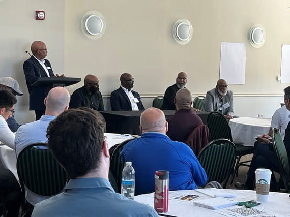 Panelists share perspectives on community engagement, education, workforce development, and economic mobility during the Men in Motion Summit at Eastern Michigan University.