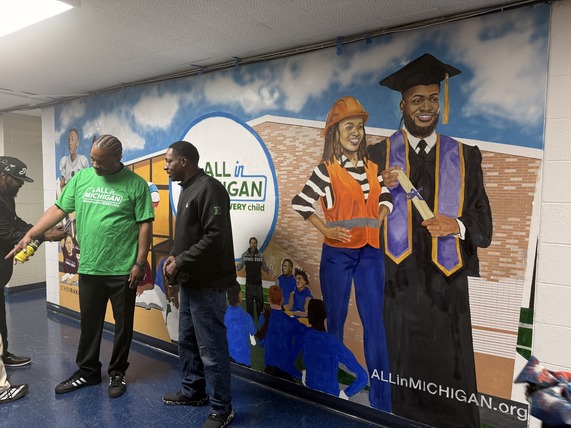 Sound Mind Sound Body founder and president Curtis Blackwell II stands beside the newly unveiled All In Michigan mural during the Lights On After School celebration in Detroit on Oct. 26, 2026. Sound Mind Sound Body founder and president Curtis Blackwell II stands beside the newly unveiled All In Michigan mural during the Lights On After School celebration in Detroit on Oct. 26, 2026.