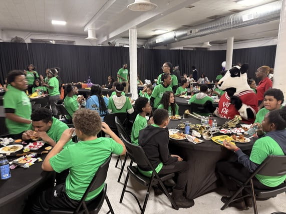 Students enjoy dinner and spend time with the Chick-fil-A mascot during the Lights On Afterschool event hosted by Sound Mind Sound Body. Students enjoy dinner and spend time with the Chick-fil-A mascot during the Lights On Afterschool event hosted by Sound Mind Sound Body.