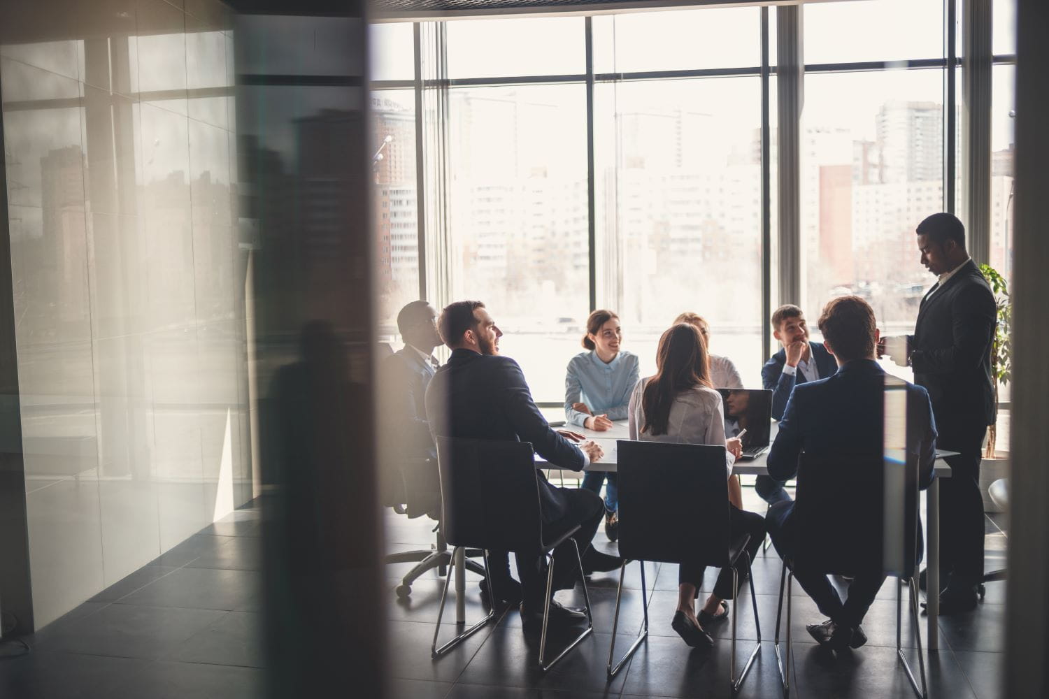 Several individuals in a meeting in a conference room