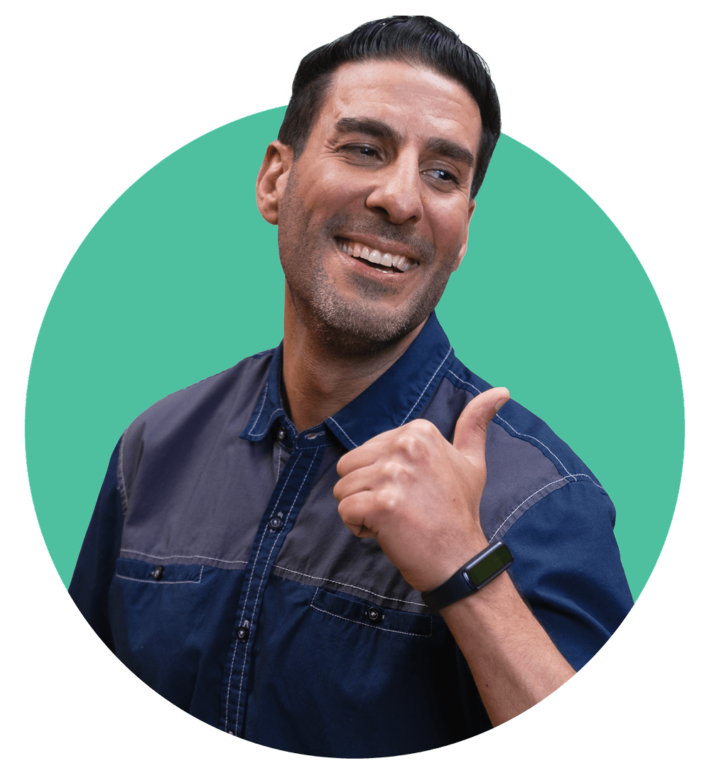 Smiling, confident middle-aged man giving a thumbs up in-front of a teal circle