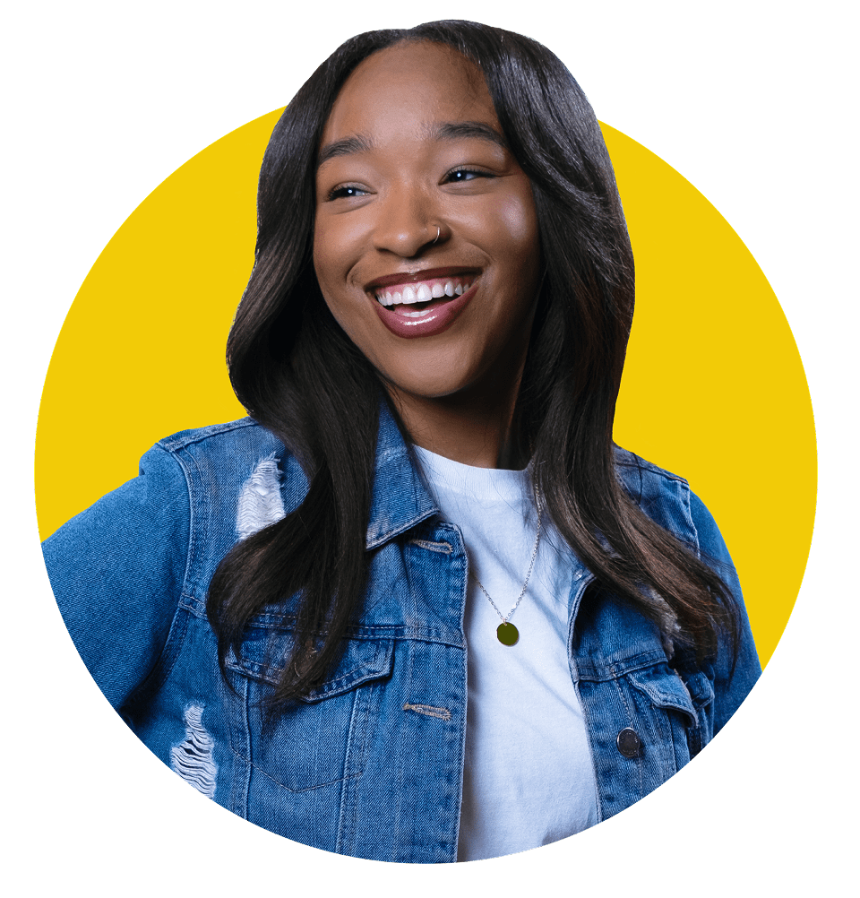Smiling, confident young woman in-front of a yellow circle